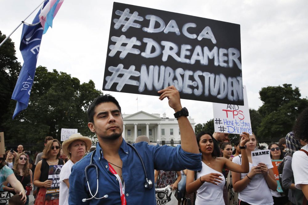 Carlos Esteban, 31, of Woodbridge, Va., a nursing student and recipient of Deferred Action for Childhood Arrivals, known as DACA, rallies with others in support of DACA outside of the White House, in Washington. (Jacquelyn Martin/AP)