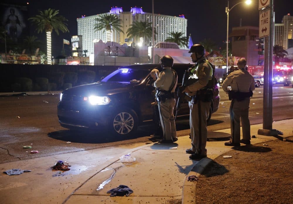 Las Vegas Police stand along the Las Vegas Strip Monday morning. (John Locher/AP)
