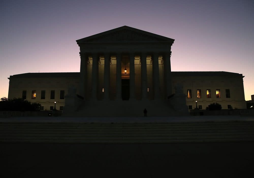 The sun begins to rise behind the U.S. Supreme Court, on Oct. 2, 2017, in Washington, D.C. This session the high court will hear several cases including Wisconsin redistricting and the case of the Colorado baker who refused to make a wedding cake for a gay couple. (Mark Wilson/Getty Images)