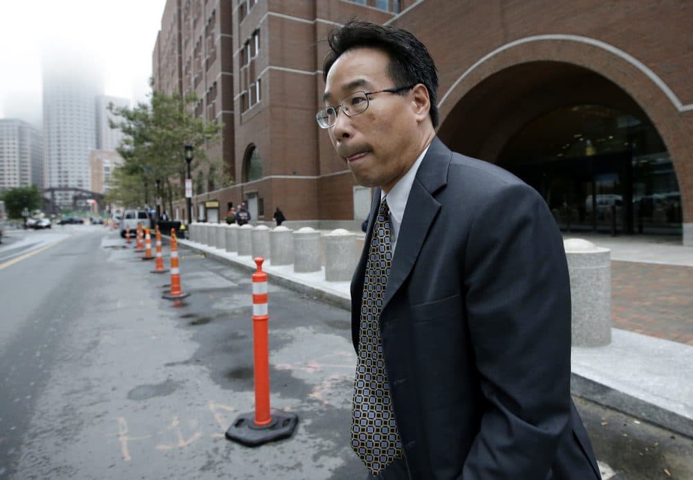 Glenn Chin, the supervisory pharmacist at the now-closed New England Compounding Center, departs federal court after attending the first day of his trial on Sept. 19. (Steven Senne/AP)