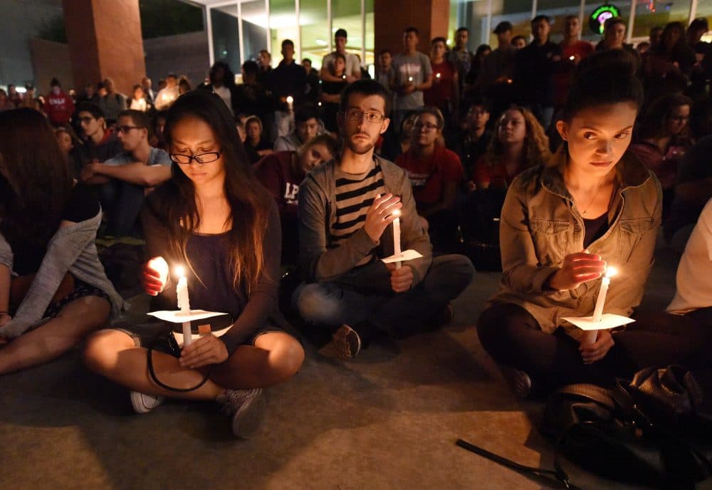 People attend a candlelight vigil at the University of Nevada Las Vegas student union Oct. 2, 2017. (Robyn Beck/AFP/Getty Images)