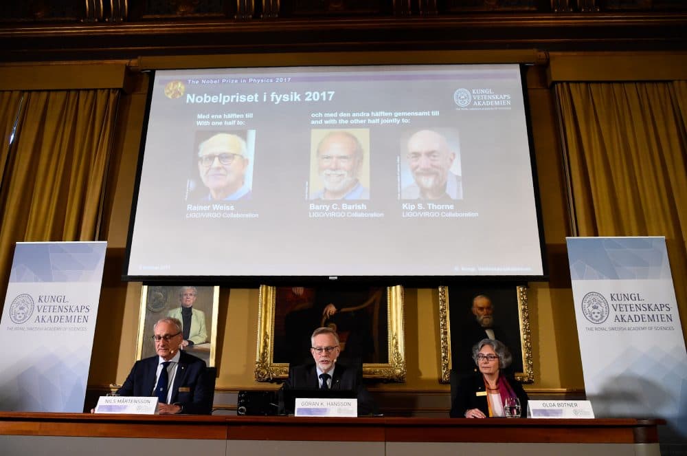Nobel Committee for Physics members (bottom, left to right) chairman, professor Nils Martensson, Goran K. Hansson, secretary general of the Royal Swedish Academy of Sciences and Olga Botner, professor of experimental elementary particle physics, announce the 2017 winner of the Nobel Prize in Physics on Oct. 3, 2017, at the Royal Swedish Academy of Sciences in Stockholm. 2017 laureates for the Nobel Prize in Physics (on the display, left to right) are Rainer Weiss, Barry C. Barish and Kip S. Thorne. (Jonathan Nackstrand/AFP/Getty Images)