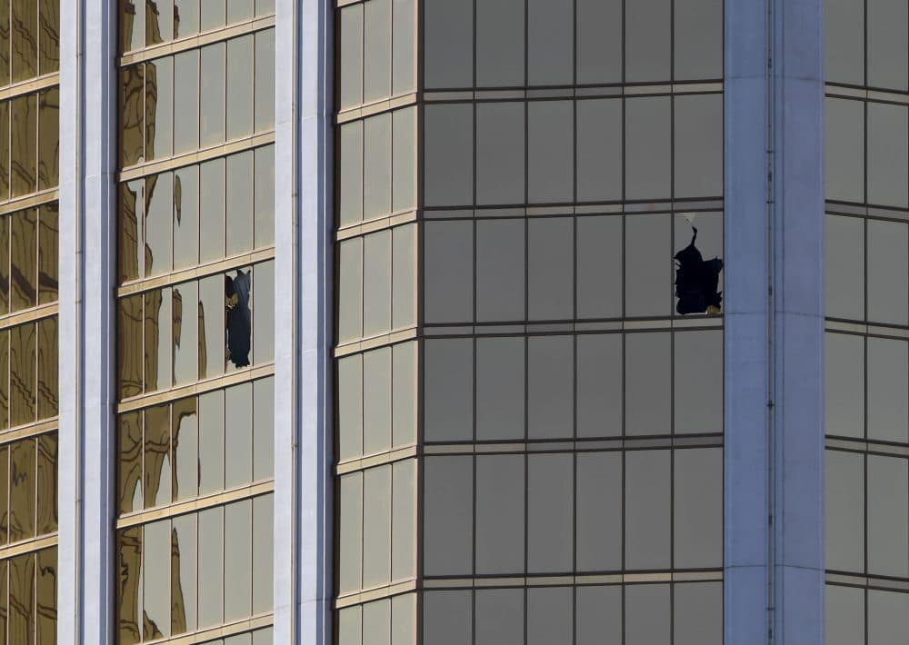 The damaged windows on the 32nd-floor room that was used by the shooter in the Mandalay Hotel after a gunman killed at least 59 people and wounded more than 500 others when he opened fire on a country music concert in Las Vegas on Oct. 2, 2017. (Mark Ralston/AFP/Getty Images)