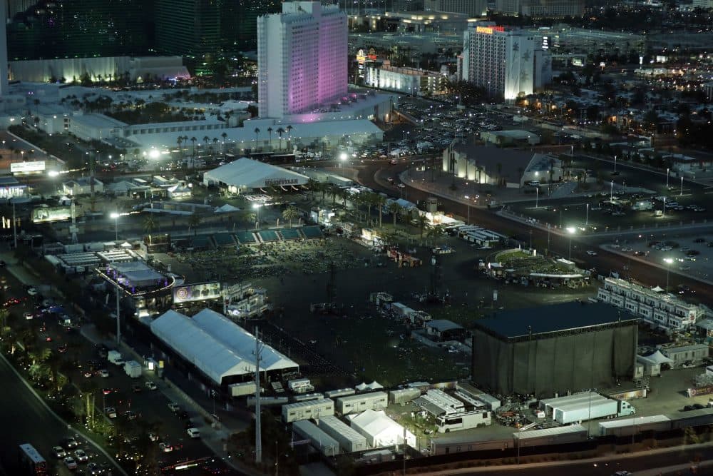 The festival grounds across the street from the Mandalay Bay resort and casino, where a mass shooting occurred, is seen at nighttime Tuesday, Oct. 3, 2017, in Las Vegas. Authorities said Stephen Craig Paddock broke windows at the resort and began firing with a cache of weapons Sunday, killing dozens and injuring hundreds at a music festival. (Marcio Jose Sanchez/AP)