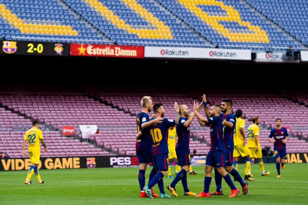 FC Barcelona celebrates in front of empty stands during their match with Las Palmas. (Alex Caparros/Getty Images)