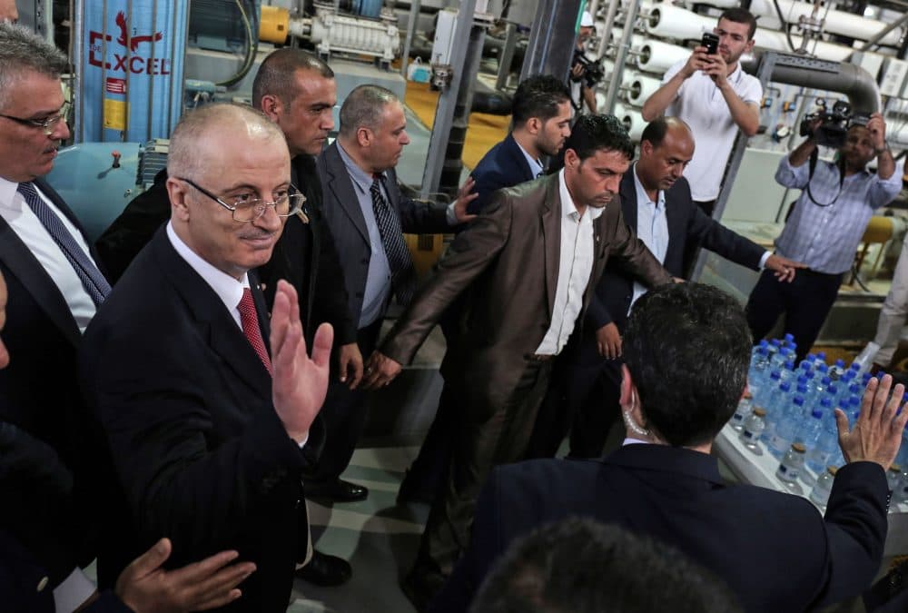 Palestinian Prime Minister Rami Hamdallah (left) visits a water desalination plant in Deir el-Balah in central Gaza on Oct. 5, 2017. (Said Khatib/AFP/Getty Images)