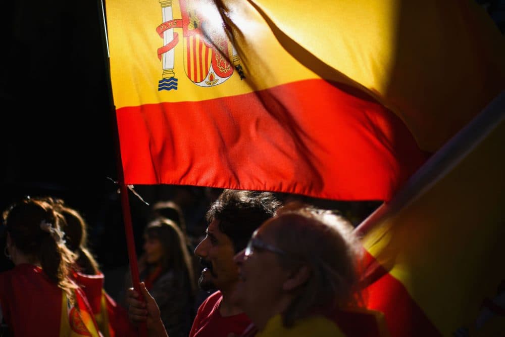 People make their way home following a rally march against independence through Barcelona in response to the disputed referendum on Catalan independence, Oct. 8, 2017. Catalonia's president Carles Puigdemont will address the Catalan Parliament on Oct. 10 to discuss the result of the referendum that was held on Oct. 1. (Jeff J Mitchell/Getty Images)