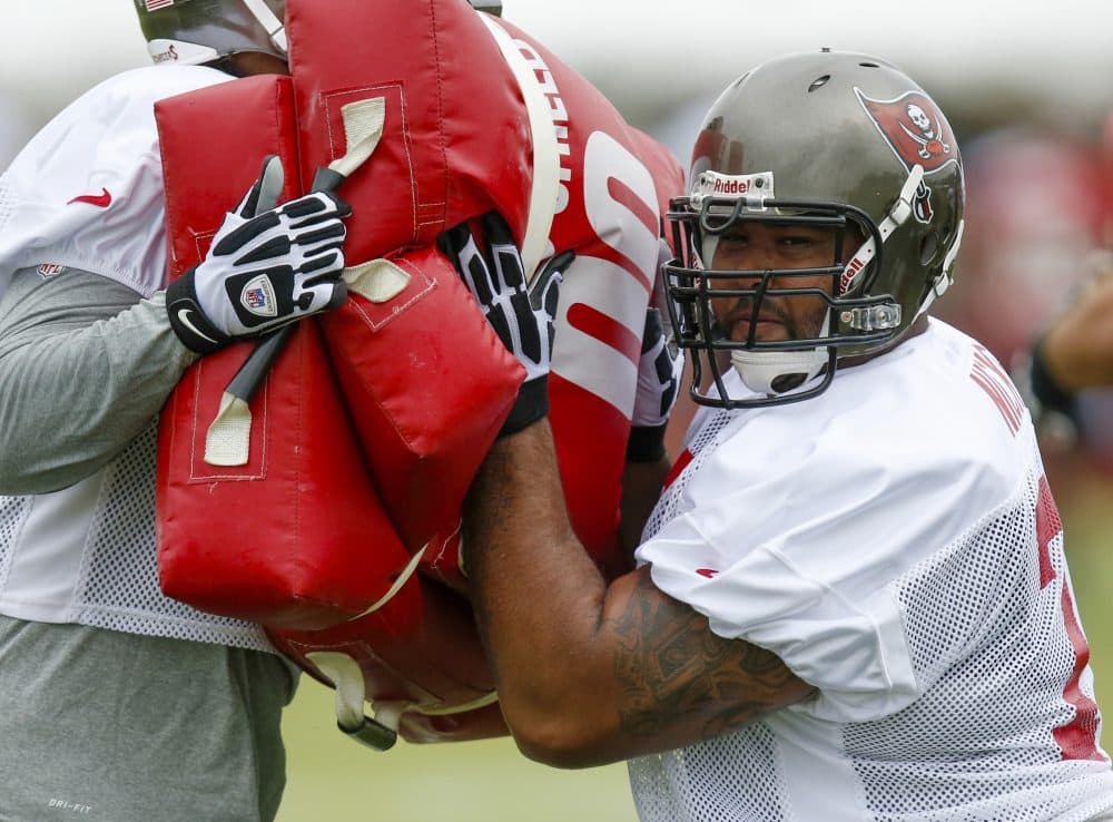 In this July 25, 2013, file photo, Tampa Bay Buccaneers guard Carl Nicks participates in a drill during NFL football training camp in Tampa, Fla. The two-time All-Pro had been diagnosed as having MRSA in a blister on the left side of his foot during training camp in August. (Mike Carlson/AP)