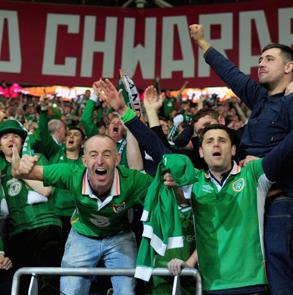 Fans of Irish national soccer celebrate their team's victory over Wales in the World Cup qualifyer. (Harry Trump/Getty Images)