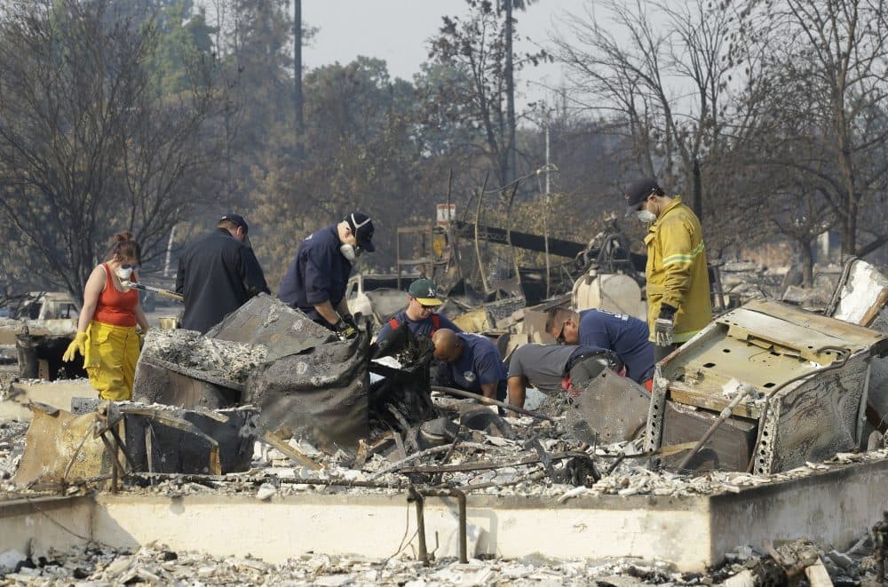 Authorities sift through the burned area of a home as they search for victims at Coffey Park area of Santa Rosa, Calif., Monday, Oct. 16, 2017. (Rich Pedroncelli/AP)