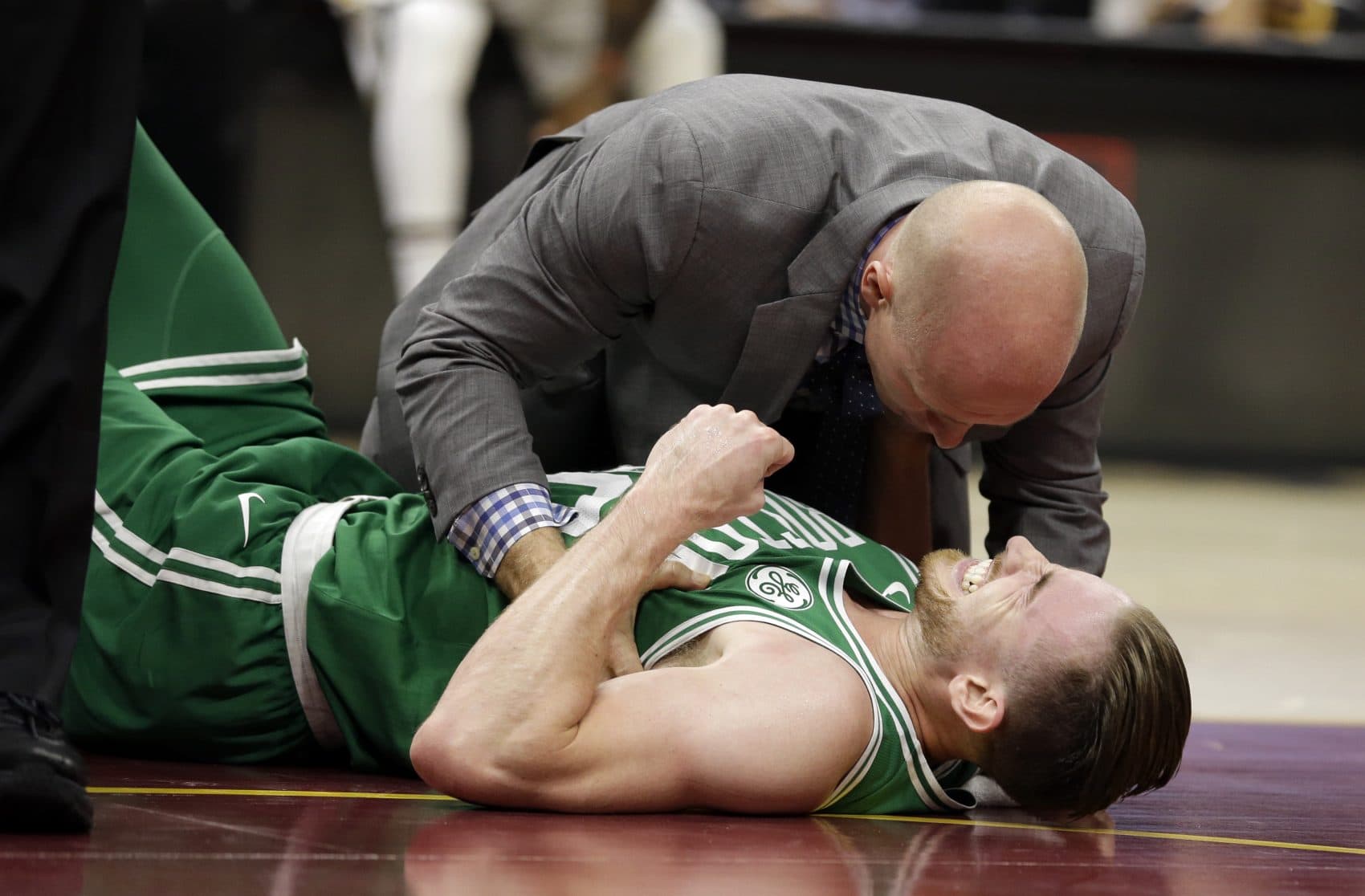 Just five minutes into his Boston career, new Celtics star forward Gordon Hayward gruesomely broke his left ankle, an injury that may end his season. (Tony Dejak/AP)