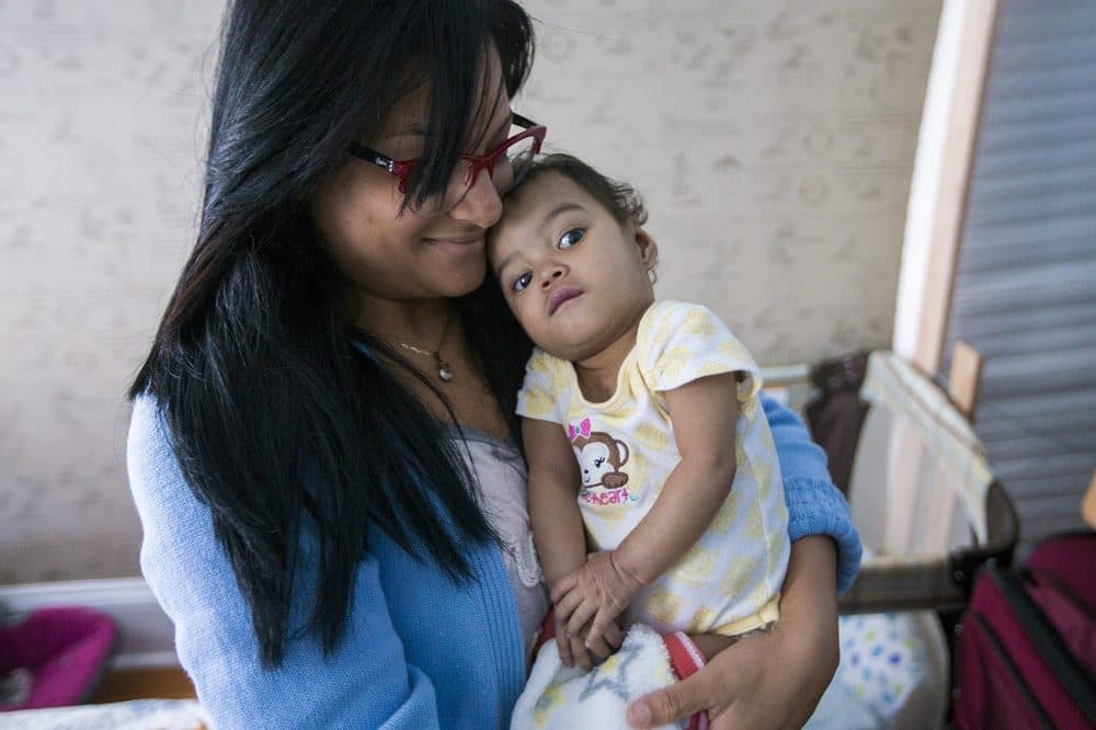 Alianette Andino and her 14-month-old daughter, Amaia, are in Boston to get an appointment at Children's Hospital to deal with a rare heart condition Amaia has. (Jesse Costa/WBUR)