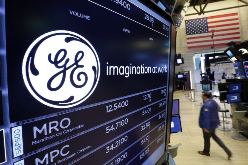 The General Electric logo appears above a trading post on the floor of the New York Stock Exchange. (Richard Drew/AP)