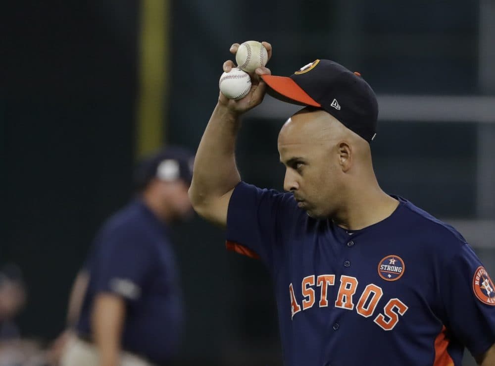 Houston Astros bench coach Alex Cora tips his hat during batting practice before Game 6 of the American League Championship Series baseball game against the New York Yankees Friday, Oct. 20, 2017, in Houston. (David J. Phillip/AP Photo)