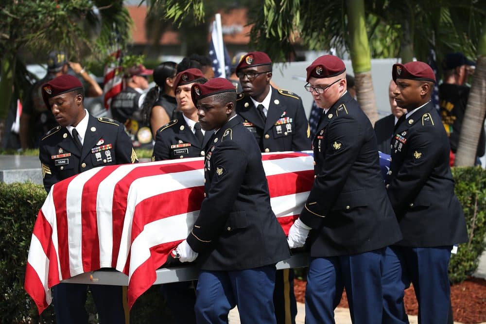 U.S. military honor guards carry the casket of U.S. Army Sgt. La David Johnson during his burial service at the Memorial Gardens East cemetery on Oct. 21, 2017 in Hollywood, Fla. Johnson and three other American soldiers were killed in an ambush in Niger on Oct. 4. (Joe Raedle/Getty Images)