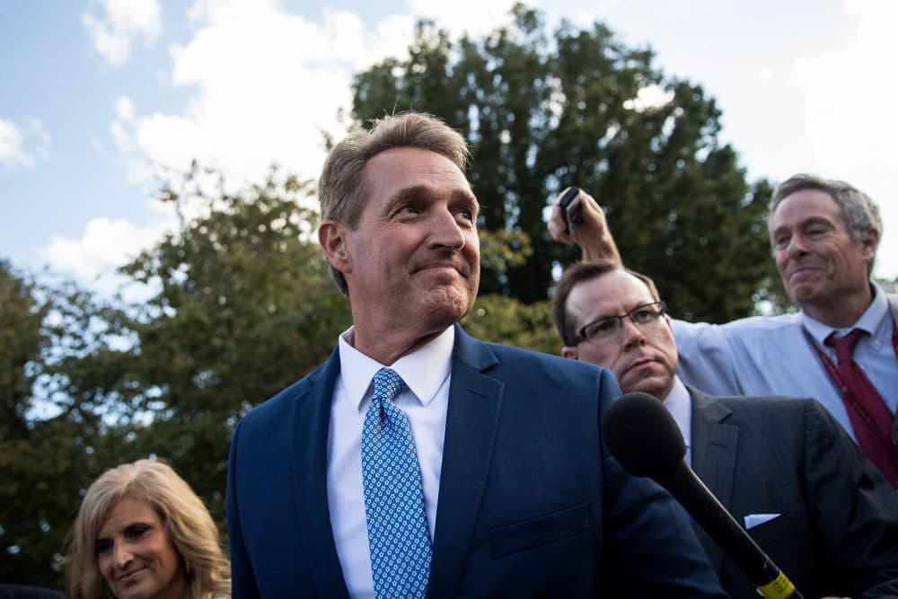 Sen. Jeff Flake (R-Ariz.) and his wife Cheryl Flake leave the U.S. Capitol as they are trailed by reporters, Oct. 24, 2017 in Washington, D.C. Flake announced that he will not be seeking re-election and he will leave the Senate after his term ends in 14 months. (Drew Angerer/Getty Images)