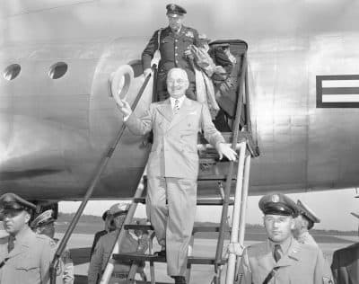 President Harry Truman walks down a plane ramp upon his arrival in Kansas City on Sept. 29, 1949. (AP Photo)