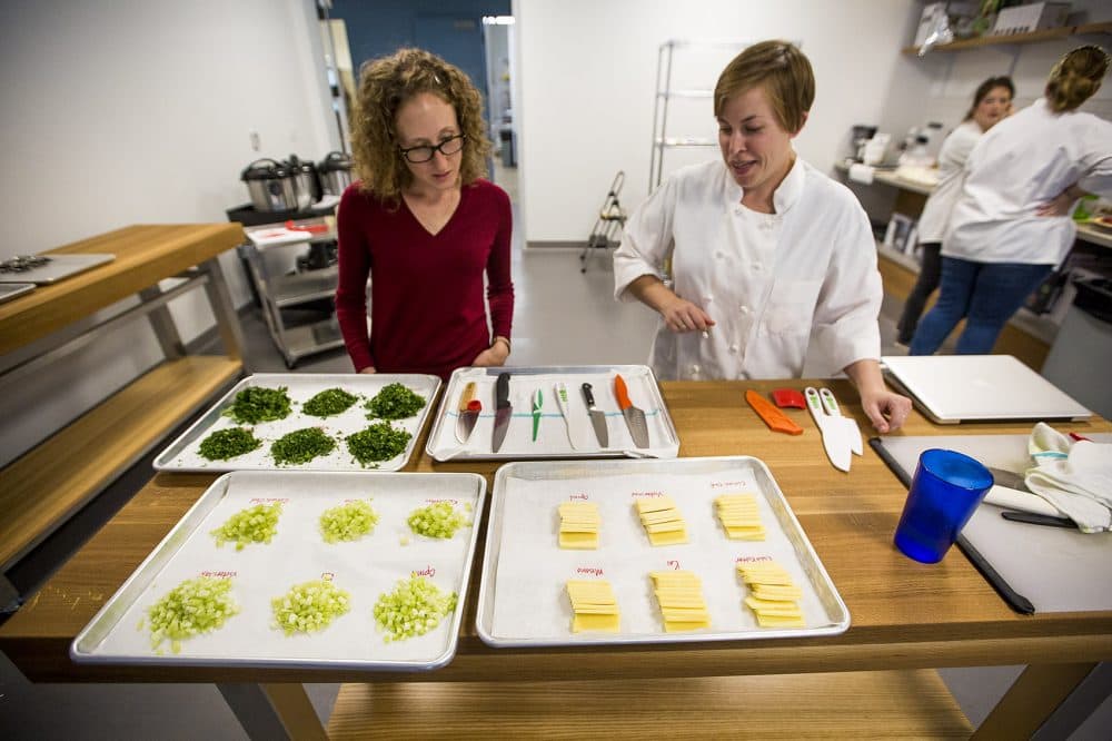 In the new Tasting and Testing kitchen, Brianna Palma and Kate Shannon review a test on chef knives for kids. (Jesse Costa/WBUR)