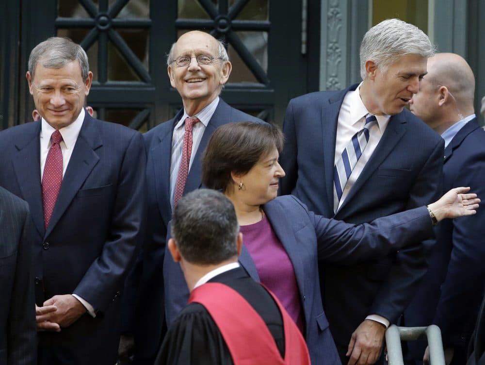 United States Supreme Court Chief Justice John Roberts, left, and Associate Justices Anthony Kennedy, second from left, Neil Gorsuch, right, and Elena Kagan, front, stand together Thursday, Oct. 26, 2017, at Harvard Law School on the campus of Harvard University, in Cambridge, Mass. The justices were on campus to open a bicentennial summit for the law school. (Steven Senne/AP)
