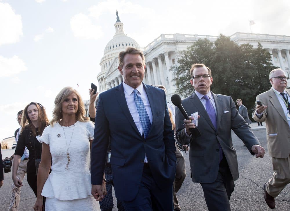 Sen. Jeff Flake (R-Ariz.) and his wife Cheryl Flake leave the U.S. Capitol as they are trailed by reporters, Oct. 24, 2017 in Washington, D.C. Flake announced that he will not be seeking re-election and he will leave the Senate after his term ends in 2018. (Drew Angerer/Getty Images)