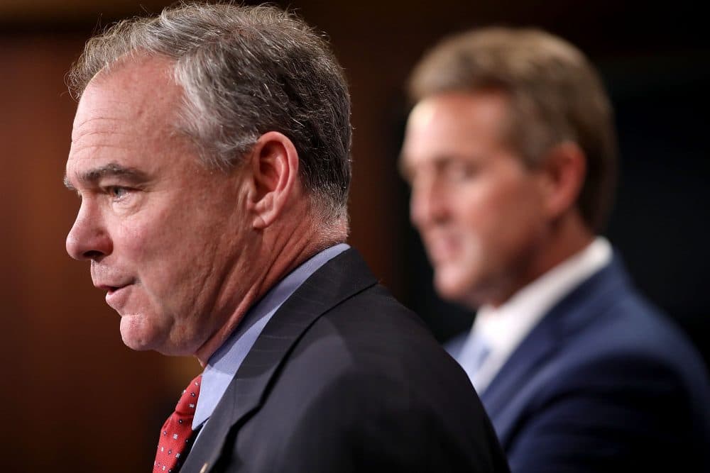 Sen. Tim Kaine (D-Va.) and Sen. Jeff Flake (R-Ariz.) talk about their introduction of a new Authorization for the Use of Military Force (AUMF) against the Islamic State of Iraq and Syria (ISIS), al-Qaeda and the Taliban during a news conference at the U.S. Capitol May 25, 2017 in Washington, D.C. (Chip Somodevilla/Getty Images)