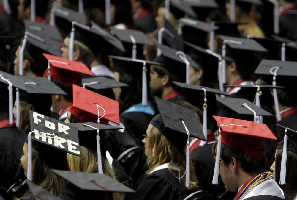 Students attend graduation ceremonies. (Butch Dill/AP)