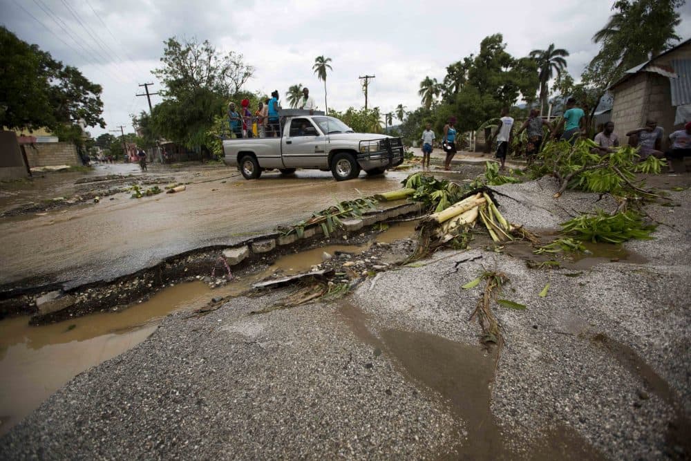 A truck negotiates a road damaged by Hurricane Matthew, in Petit Goave, Haiti, on Oct. 5, 2016. (Dieu Nalio Chery/AP)