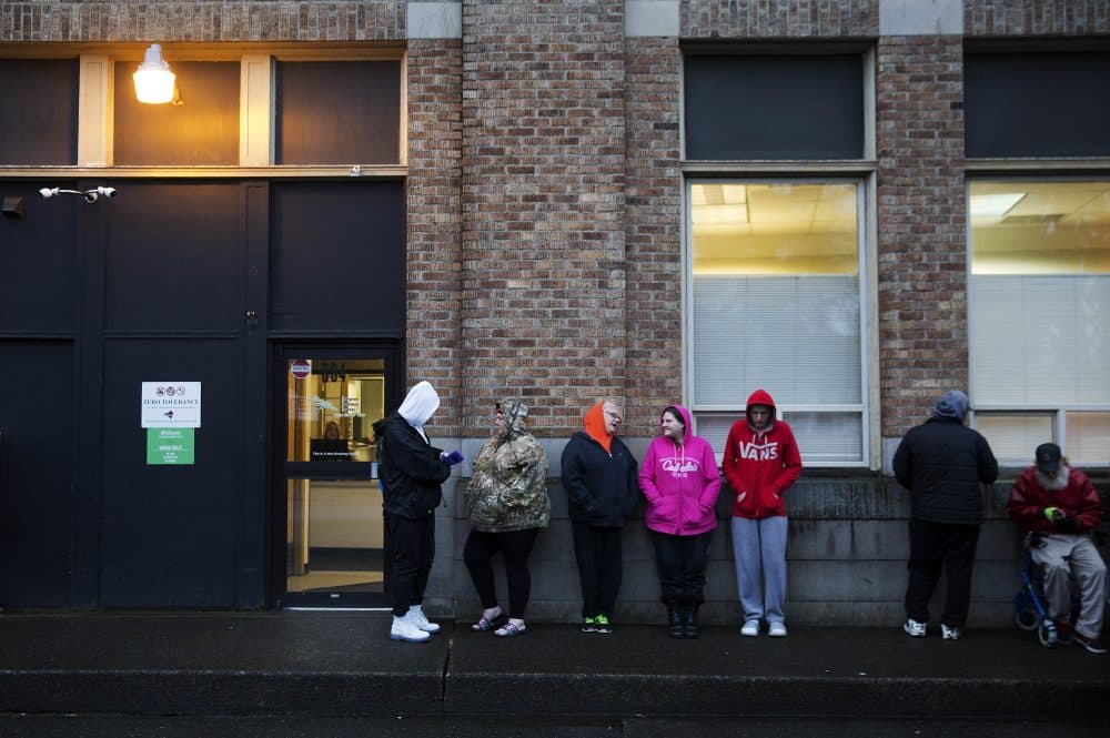 People wait in line for the Evergreen Treatment Services methadone clinic to open in Hoquiam, Wash., Thursday, June 15, 2017. (David Goldman/AP)