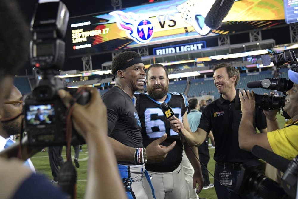 Carolina Panthers quarterback Cam Newton talks to reporters on the field after an NFL preseason football game against the Jacksonville Jaguars, Thursday, Aug. 24, 2017, in Jacksonville, Fla. (Phelan M. Ebenhack/AP)

