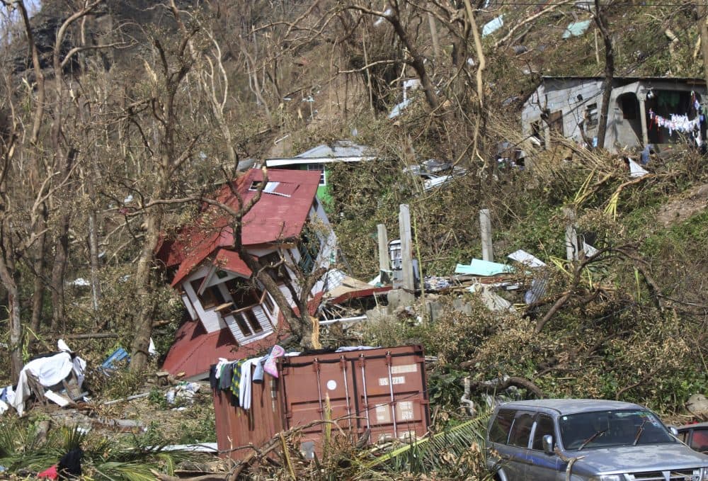 In this Sept. 23 photo, homes lay scattered after the passing of Hurricane Maria in Roseau, the capital of the island of Dominica. (Carlisle Jno Baptiste/AP)