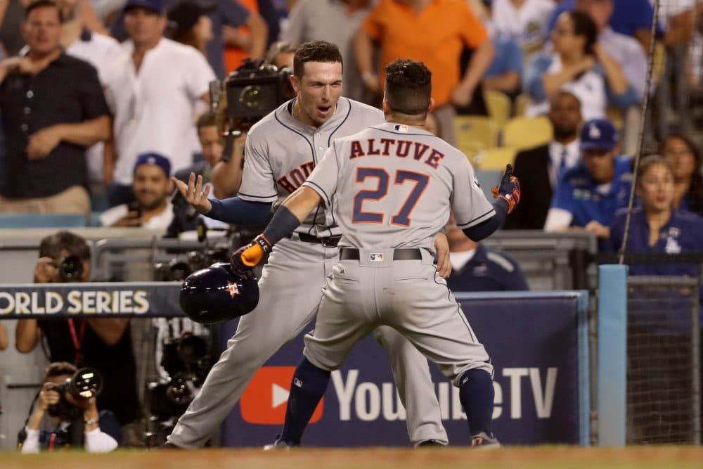 Jose Altuve and Alex Bregman of the Houston Astros celebrate during the tenth inning of Game 2. (Christian Petersen/Getty Images)