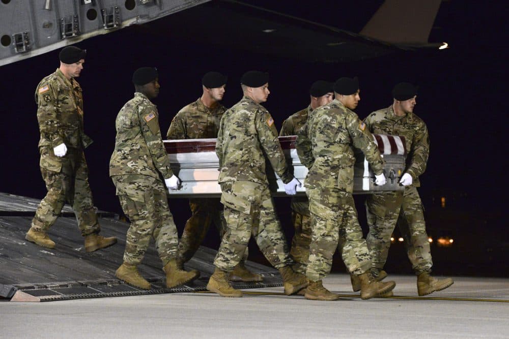 A U.S. Army team transfers the remains of Army Staff Sgt. Dustin Wright upon arrival at Dover Air Force Base, Del. (Staff Sgt. Aaron J. Jenne/U.S. Air Force via AP)