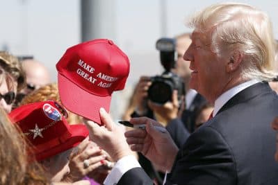 President Donald Trump hands a signed &quot;Make America Great Again,&quot; hat back to a supporter, Wednesday, Aug. 23, 2017, in Reno, Nev. (Alex Brandon/AP)
