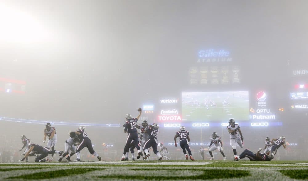 New England Patriots quarterback Tom Brady throws in the fog against the Atlanta Falcons during an NFL football game at Gillette Stadium in Foxborough, Mass. Sunday, Oct. 22, 2017. (Winslow Townson/AP Images for Panini)