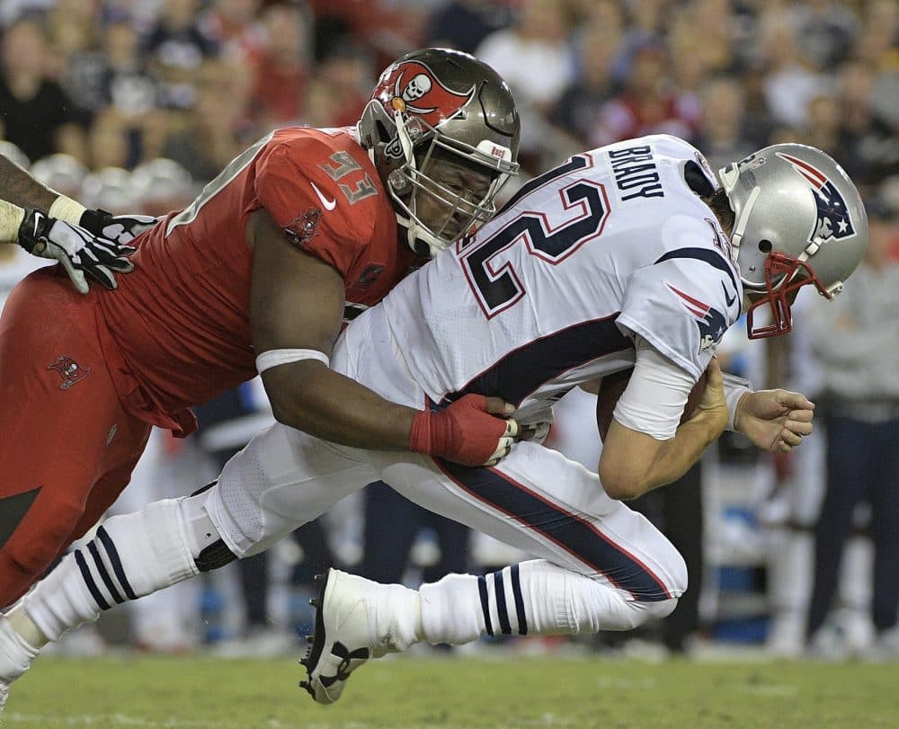 Tampa Bay Buccaneers defensive tackle Gerald McCoy (93) sacks New England Patriots quarterback Tom Brady (12) during the second quarter of an NFL football game Thursday, Oct. 5, 2017, in Tampa, Fla. (AP Photo/Phelan Ebenhack)