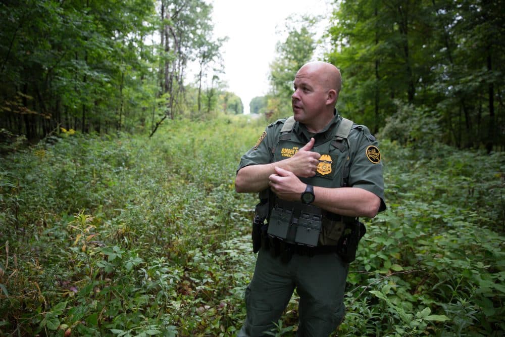 U.S. Border Patrol Agent Brad Brant shows a commonly patrolled area along the U.S.-Canada border, where sometimes people attempt to smuggle drugs and people across the border. (Ryan Caron King/New England News Collaborative)