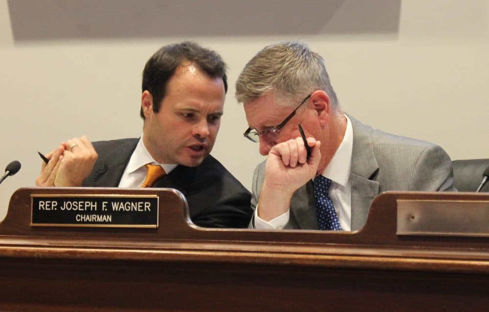Sen. Eric Lesser and Rep. Joseph Wagner (right), chairmen of the Economic Development and Emerging Technologies Committee, consulted during Tuesday's hearing. (Photo: Sam Doran/SHNS)