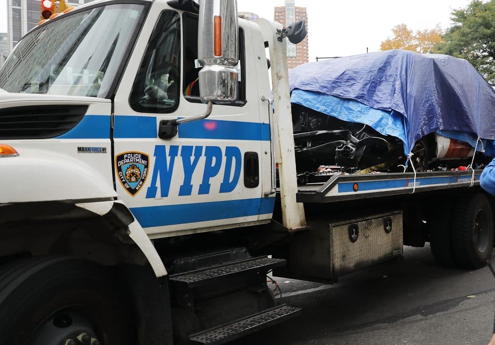 The crashed vehicle used in what is being described as a terrorist attack is moved away from the scene in lower Manhattan the day after the event on Nov. 1, 2017 in New York City. (Spencer Platt/Getty Images)