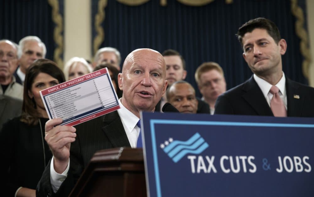 House Ways and Means Committee Chairman Kevin Brady, R-Texas, joined by Speaker of the House Paul Ryan, R-Wis., right, holds a proposed &quot;postcard tax filing form&quot; as they unveil the GOP's far-reaching tax overhaul, the first major revamp of the tax system in three decades, on Capitol Hill in Washington, Thursday, Nov. 2, 2017. (J. Scott Applewhite/AP)