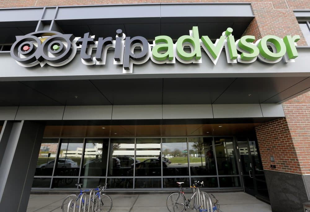 Corporate signage for the travel website TripAdvisor is seen at the company's headquarters on Nov. 2, 2017, in Needham, Mass. (Steven Senne/AP)