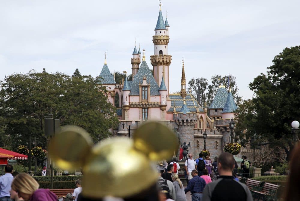 Visitors walk through Disneyland in Anaheim, California, in January 2015. (Jae C. Hong/AP)
