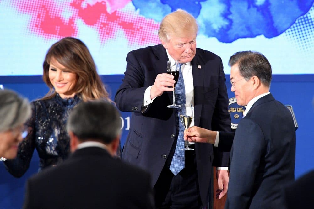 President Trump toasts South Korea's President Moon Jae-In (right) near first lady Melania Trump during a state dinner at the presidential Blue House in Seoul on Nov. 7, 2017. (Jim Watson/AFP/Getty Images)