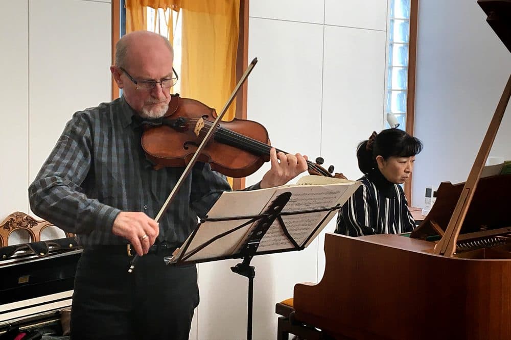 Boston Symphony Orchestra violist Michael Zaretsky and Japanese pianist Chikako Shibata rehearse ahead of their Monday concert in Ishinomaki. (Andrea Shea/WBUR)