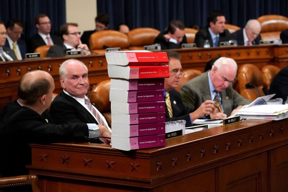 House Ways and Means Committee member Rep. Tom Reed (R-N.Y.) keeps a stack of books that document the current federal tax code and related regulations on his desk during the first markup of the proposed GOP tax reform legislation in the Longworth House Office Building on Capitol Hill Nov. 6, 2017 in Washington, D.C. (Chip Somodevilla/Getty Images)