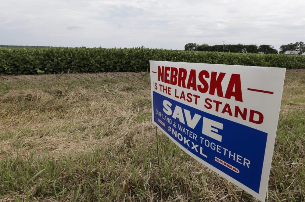 A roadside sign against the construction of the Keystone XL pipeline is seen where the proposed pipeline would go through the property of Jim Carlson, in Silver Creek, Neb. (Nati Harnik/AP)