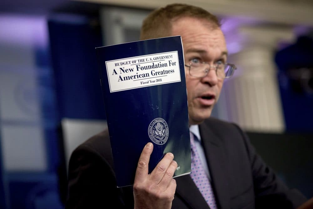 In this May 23, 2017, photo, budget director Mick Mulvaney holds up a copy of President Donald Trump's proposed fiscal 2018 federal budget as he speaks to members of the media in the Press Briefing Room of the White House in Washington. His $4.1 trillion plan for the budget year beginning Oct. 1 generally proposed deep cuts in safety net programs, including Medicaid and the Children's Health Insurance Program. (Andrew Harnik/AP)