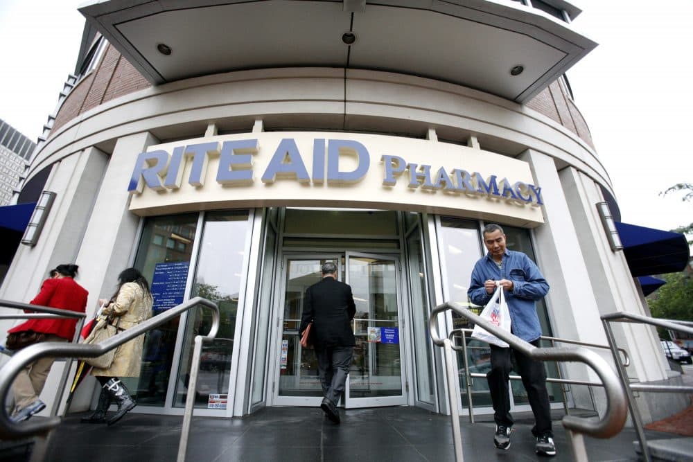 People walk outside a Rite Aid Pharmacy in Boston, Wednesday, June 24, 2009.
 (Eric J. Shelton/AP)