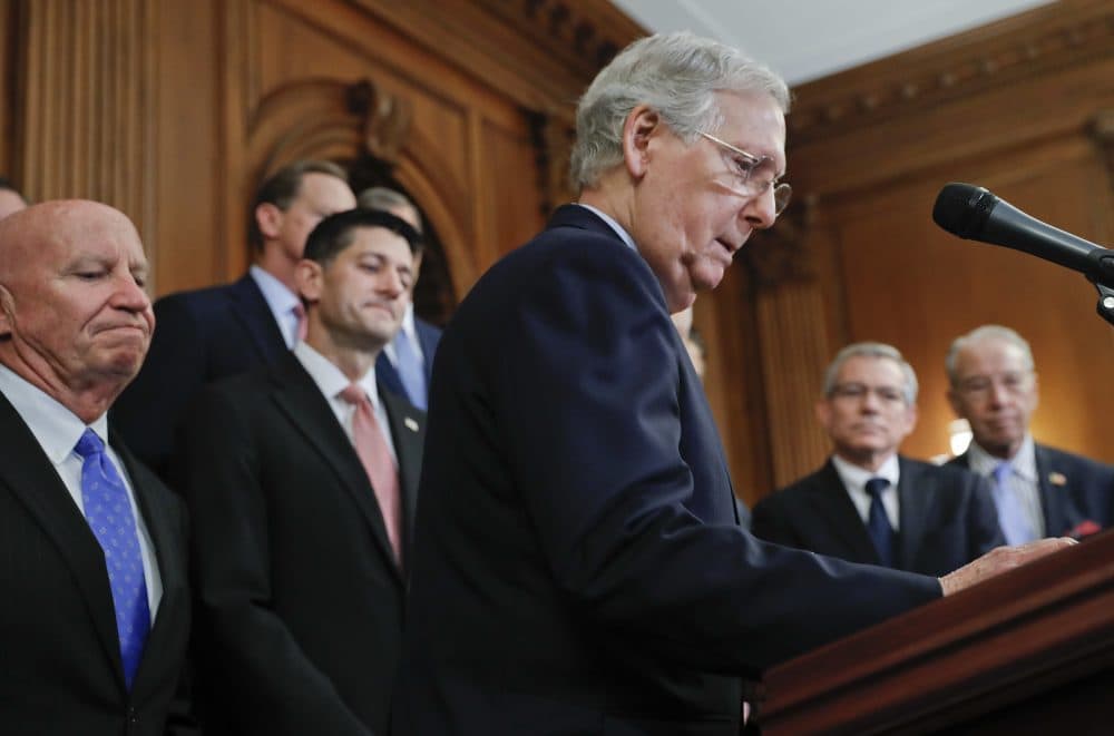 Senate Majority Leader Mitch McConnell, R-Ky., center, walks up to the podium as he is joined by from l-r., Rep. Kevin Brady, R-Texas, Speaker of the House Paul Ryan, R-Wis., Rep. David Schweikert, R-Ariz., and Charles Grassley, R-Iowa, as they meet with reporters to announce the Republicans' proposed rewrite of the tax code for individuals and corporations, at the Capitol on Sept. 27. (Pablo Martinez Monsivais/AP)