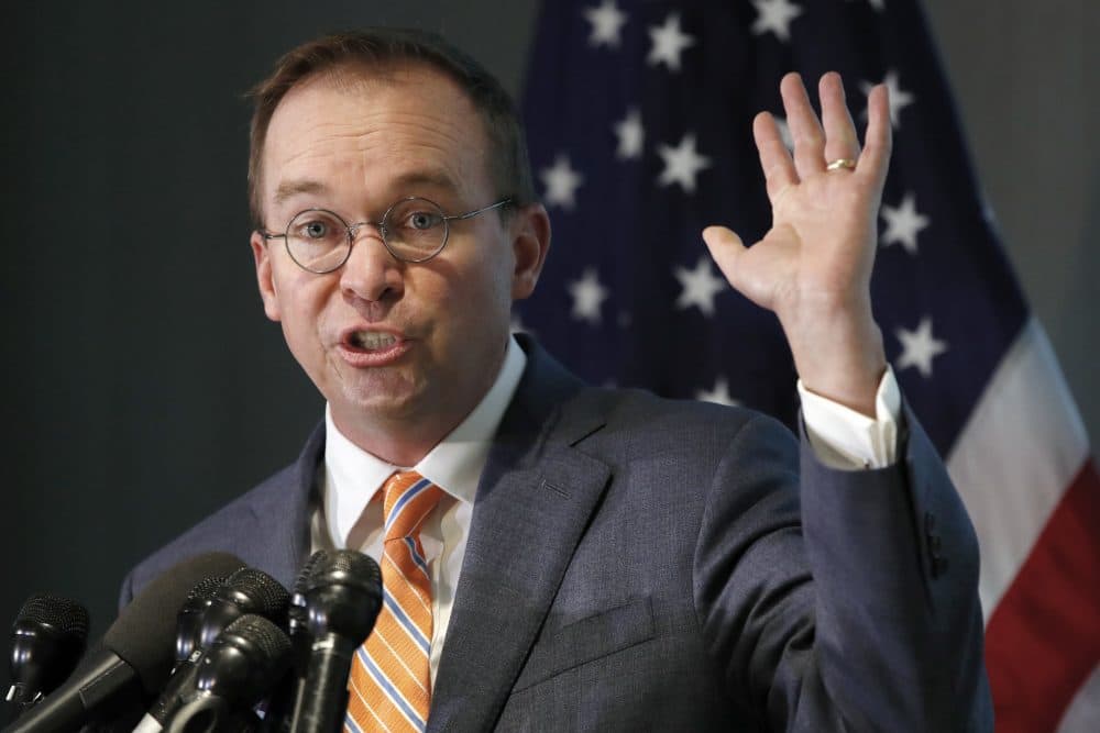 Mick Mulvaney holds up his hand as he speaks during a news conference after his first day as acting director of the Consumer Financial Protection Bureau in Washington, Monday, Nov. 27, 2017. (Jacquelyn Martin/AP)