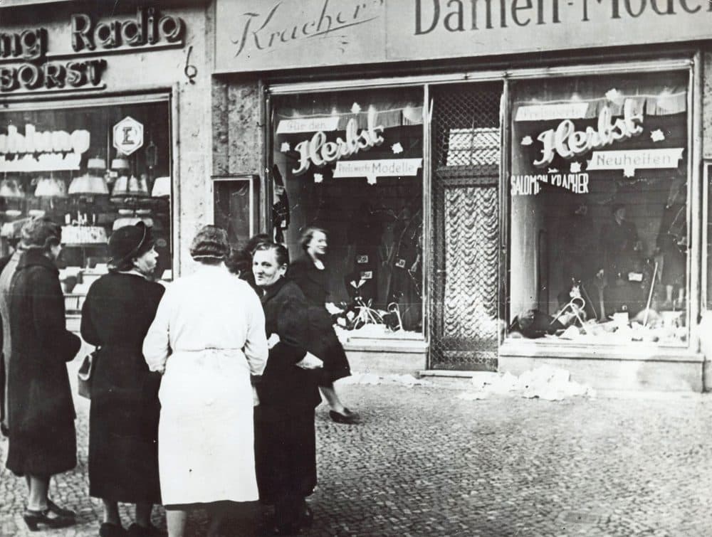 A group of people stand outside a Jewish-owned shop in an unnamed German town in November 1938, after the Kristallnacht, when Nazis burned and plundered hundreds of Jewish homes, shops and synagogues across the country. (AP)